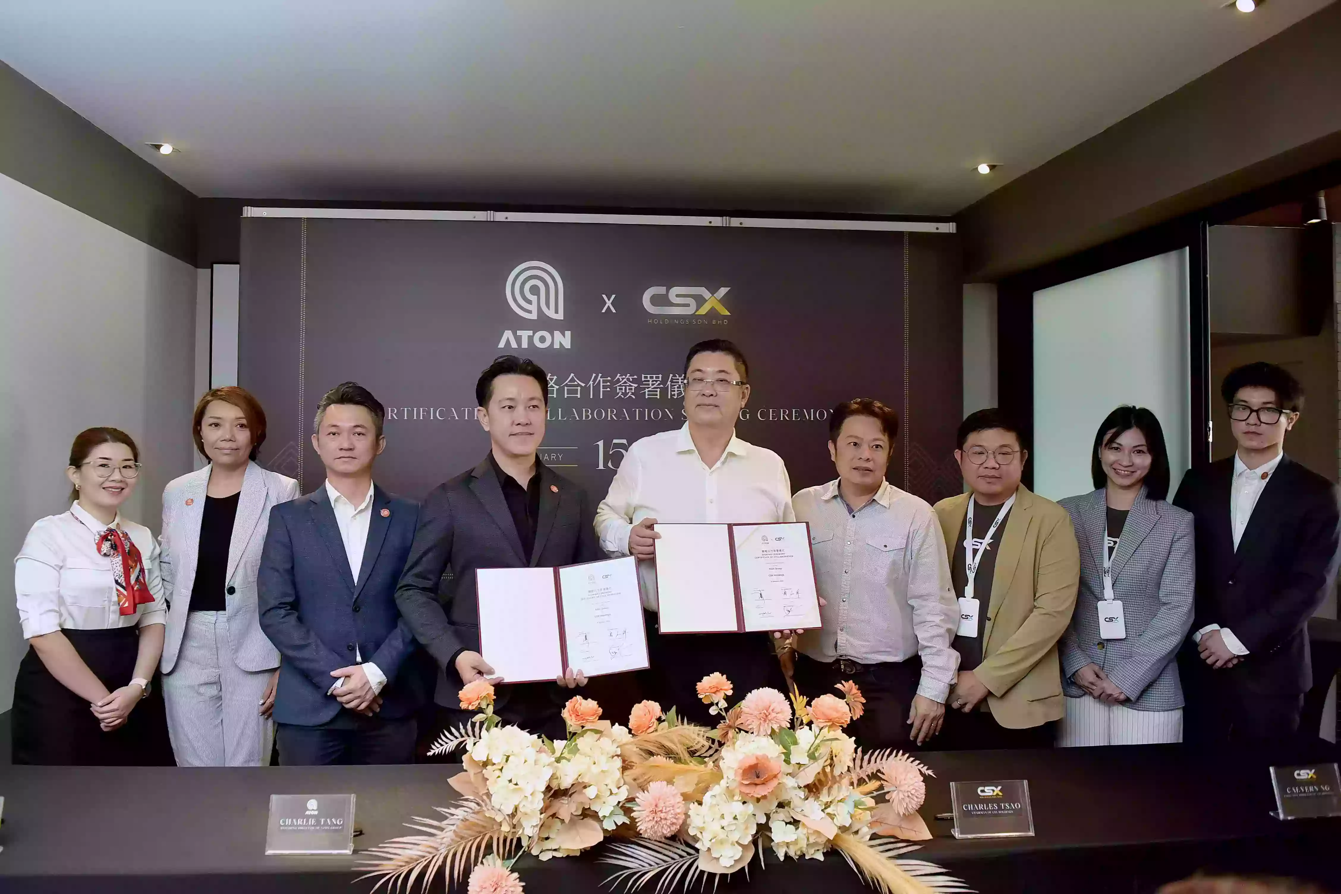 Aton Group and CSX Holdings with their signed certificate of collaboration